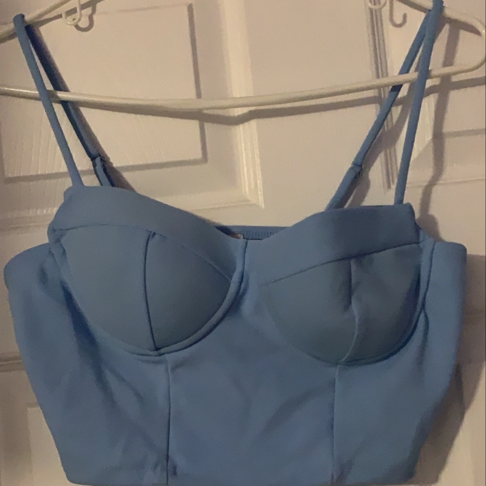 Top part of a matching set. Padded baby blue top